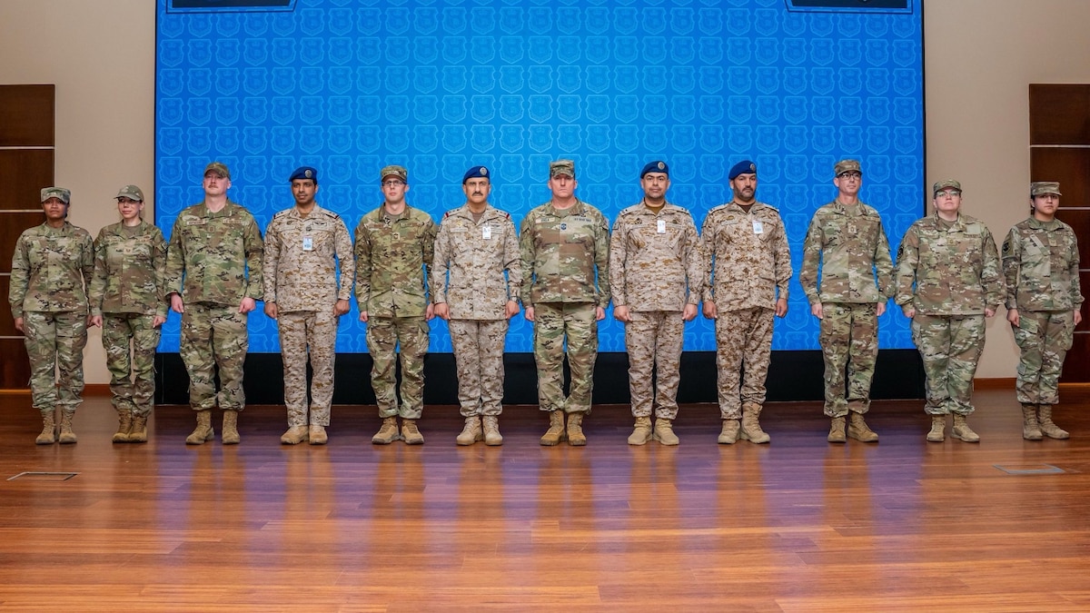 A mobile training team of U.S. Airmen assigned to Air Forces Central poses for a photo with Royal Saudi Air Force members during the graduation ceremony of the inaugural Chief Leadership Course in the Kingdom of Saudi Arabia Jan. 23, 2025. The 17-day course was modeled after the USAF’s CLC, incorporating lessons from the First Sergeants’ and Noncommissioned Officer academies.