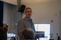 Dr. John D. Matyjas, Air Combat Command Scientific Advisor to Commander, delivers a speech during the opening of PlugFest on Feb. 10, 2025, at Beale Air Force Base, California.
