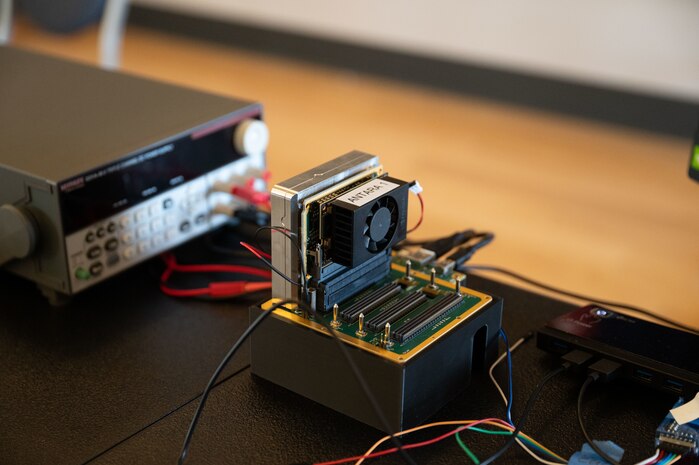 A module with small cooling fan inserted in a small 4-slot chassis at PlugFest on Feb. 11, 2025 at Beale Air Force Base, California.