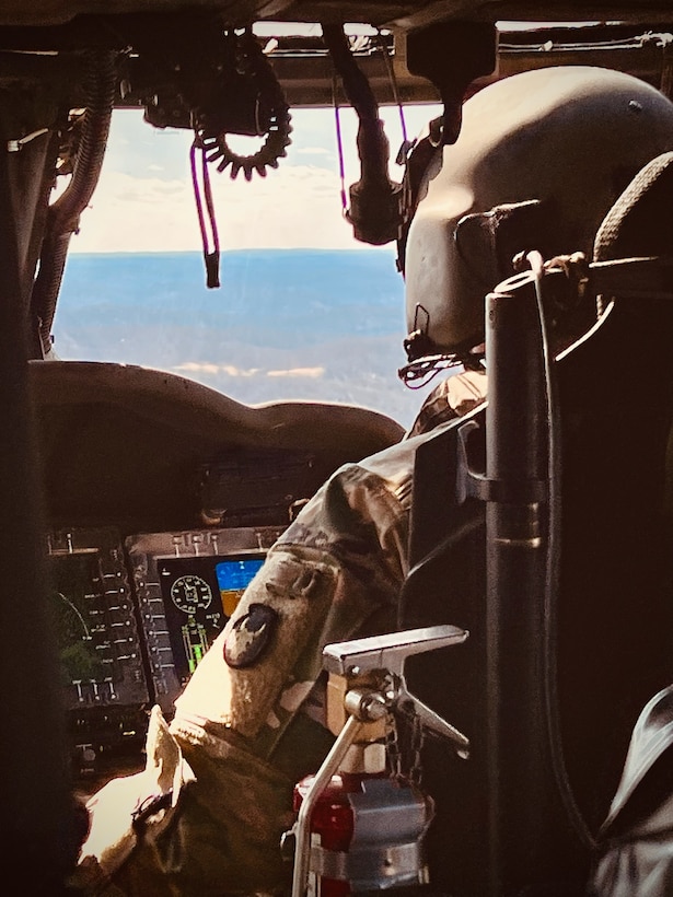 Chief Warrant Officer 2 Cameron Whitaker, pilot in command from the Kentucky National Guard 63rd Theater Aviation Brigade, flies to eastern Kentucky to aid in search efforts for stranded flood survivors on February 17, 2025.