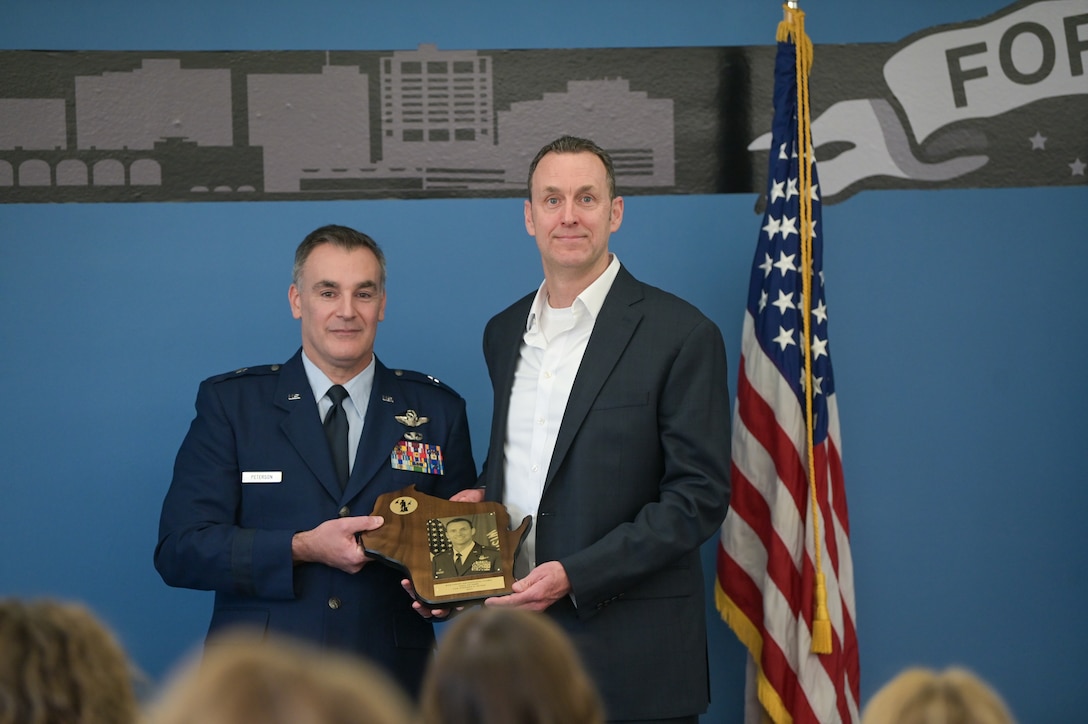 U.S. Air Force Brig. Gen. Erik Peterson, Wisconsin’s interim deputy adjutant general for Air, inducts retired Col. Stephen Dunai into the Wisconsin Air National Guard Hall of Fame Jan. 31, 2025 at Truax Field in Madison, Wisconsin.