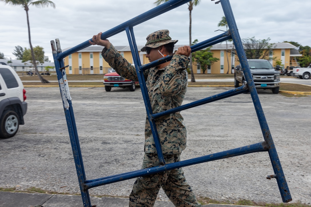 U.S. Marine Corps Sgt. Jaime Delgado, from Florida, a combat engineer with Marine Wing Support Squadron (MWSS) 272, takes down a scaffolding at the U.S. Navy's Atlantic Undersea Test and Evaluation Center on Andros Island, Bahamas, Feb. 21, 2025. MWSS-272 deployed to the Bahamas to conduct aviation ground support rehearsals and refine distributed aviation operations for 2nd Marine Aircraft Wing. (U.S. Marine Corps photo by Lance Cpl. Orlanys Diaz Figueroa)