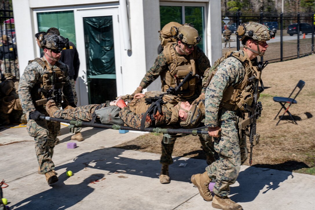 U.S Marines and Sailors with the 26th Marine Expeditionary Unit (MEU) evacuate a simulated casualty during an Expeditionary Operations Training Group (EOTG) exercise at Camp Lejeune, North Carolina, Feb. 23, 2025. The 26th MEU completed their full mission profile to assess their ability to operate as a Marine Air Ground Task Force across various crisis response scenarios. EOTG trains II Marine Expeditionary Force units in preparation for upcoming deployments in support of geographic combatant commands. (U.S. Marine Corps photo by Lance Cpl. Kyle Baskin)