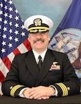 Commander Erik S. Dill
