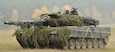 A German Army Leopard II tank, assigned to 104th Panzer Battalion, moves through the Joint Multinational Readiness Center during Saber Junction 2012  in Hohenfels, Germany, Oct. 25. The U.S. Army Europe's exercise Saber Junction trains U.S. personnel and 1800 multinational partners from 18 nations ensuring multinational interoperability and an agile, ready coalition force.