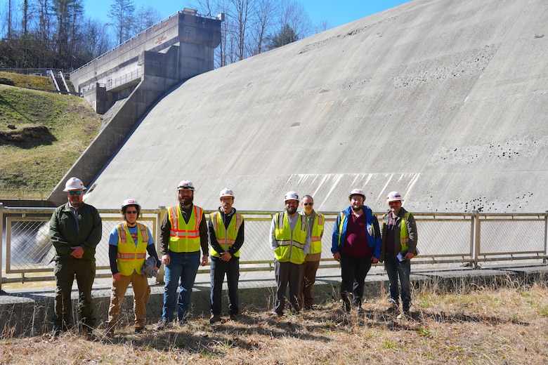 Dam inspection team pose for a photo in front of Martins Fork Dam.