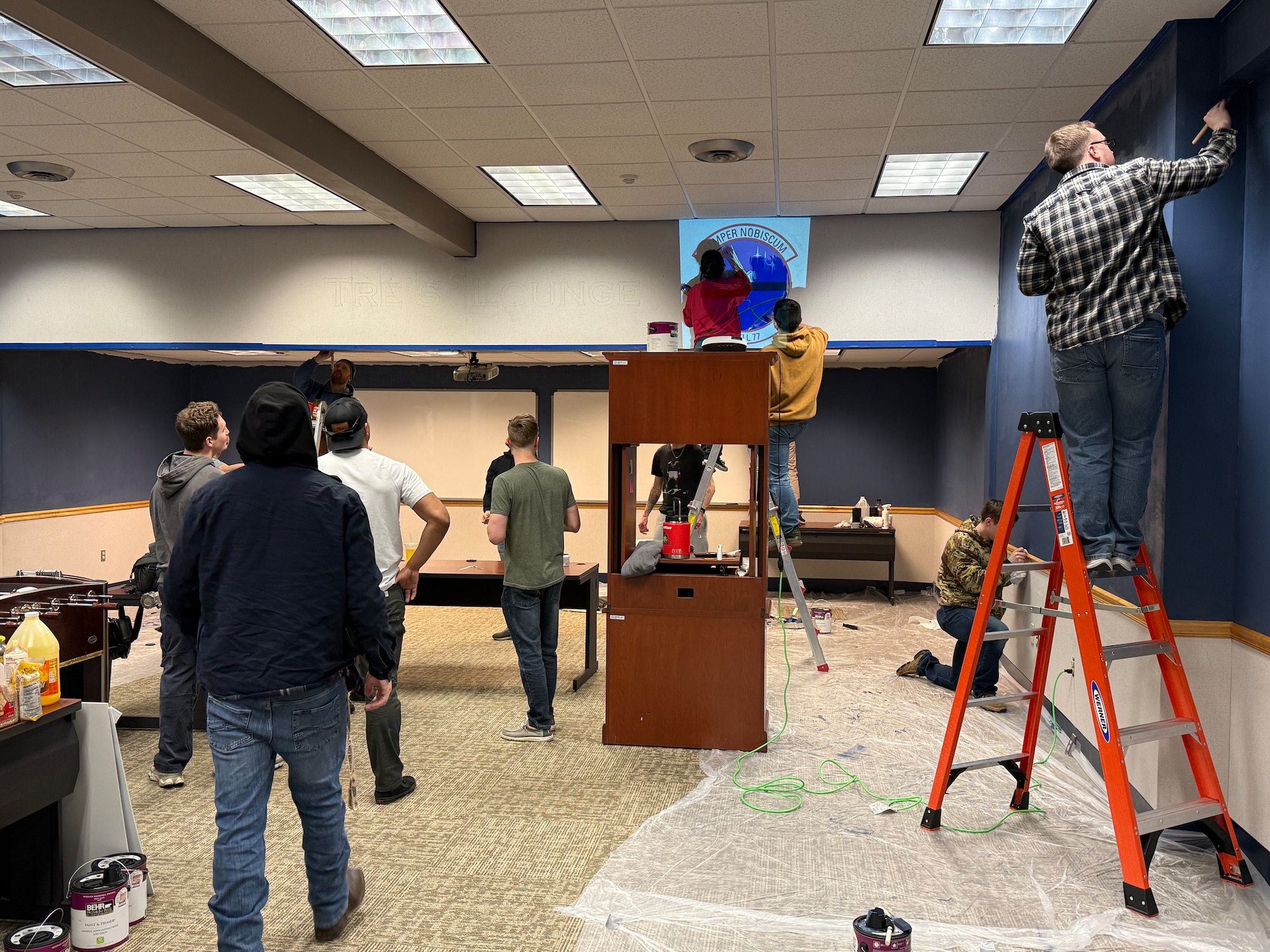 Airmen painting walls