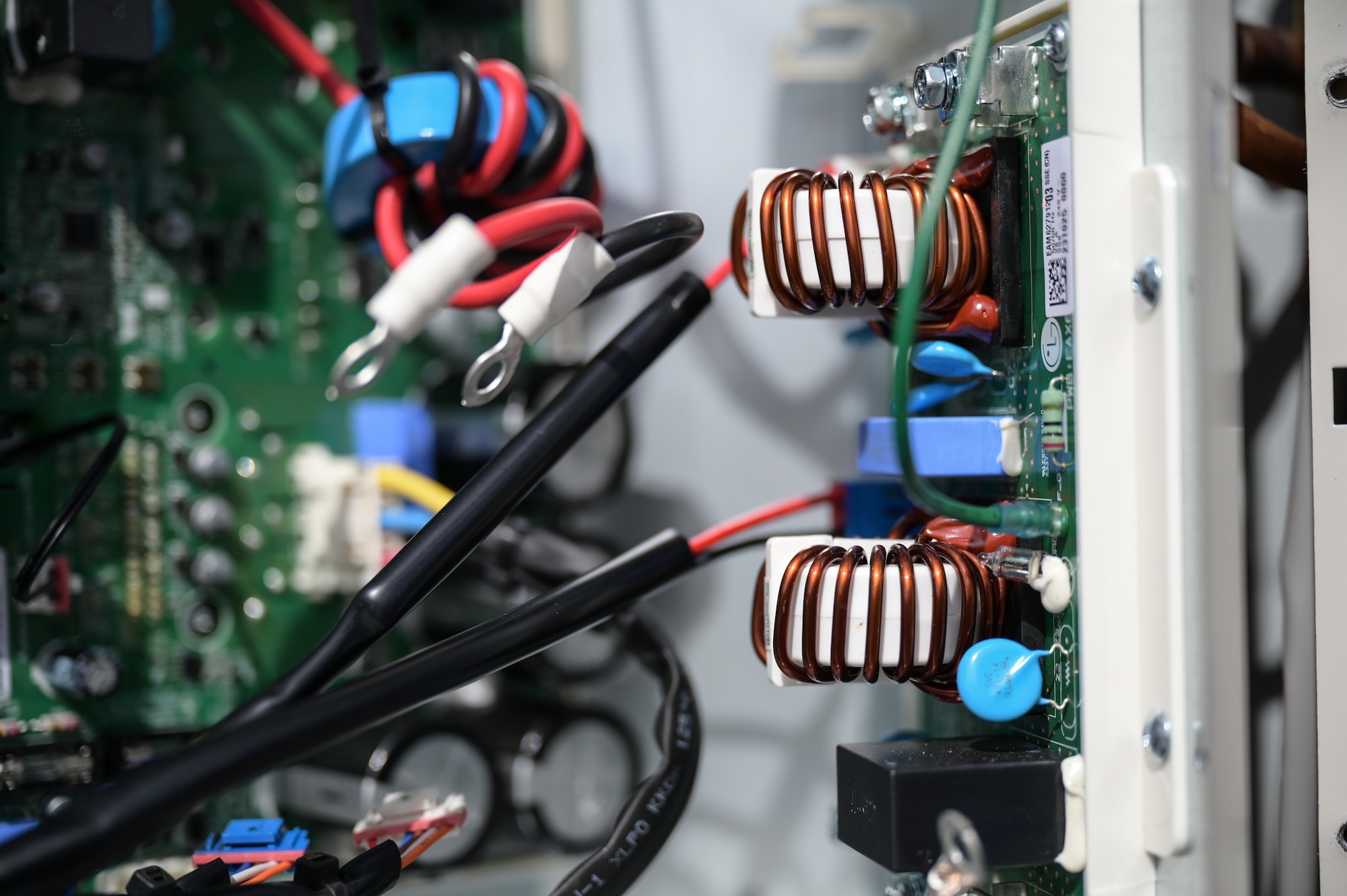 A close-up of a circuit board on an HVAC unit.
