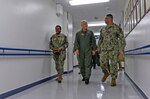 U.S. Naval Hospital (USNH) Yokosuka Executive Officer, Capt. Richard Gillard discusses the capabilities of the hospital with Commander, Naval Air Forces Vice Adm. Daniel Cheever during a tour of USNH Yokosuka.