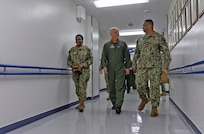 U.S. Naval Hospital (USNH) Yokosuka Executive Officer, Capt. Richard Gillard discusses the capabilities of the hospital with Commander, Naval Air Forces Vice Adm. Daniel Cheever during a tour of USNH Yokosuka.