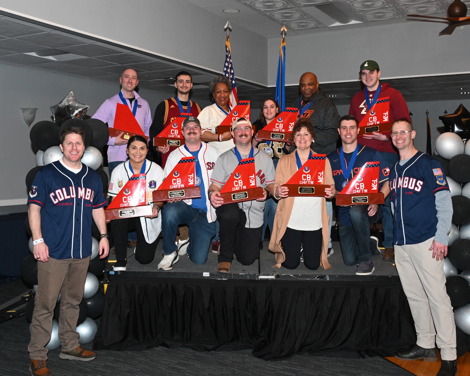 Military personnel pose for a photo at the Columbus Air Force Base Event Center during Annual Awards on Columbus Air Force Base, Feb. 21, 2025.