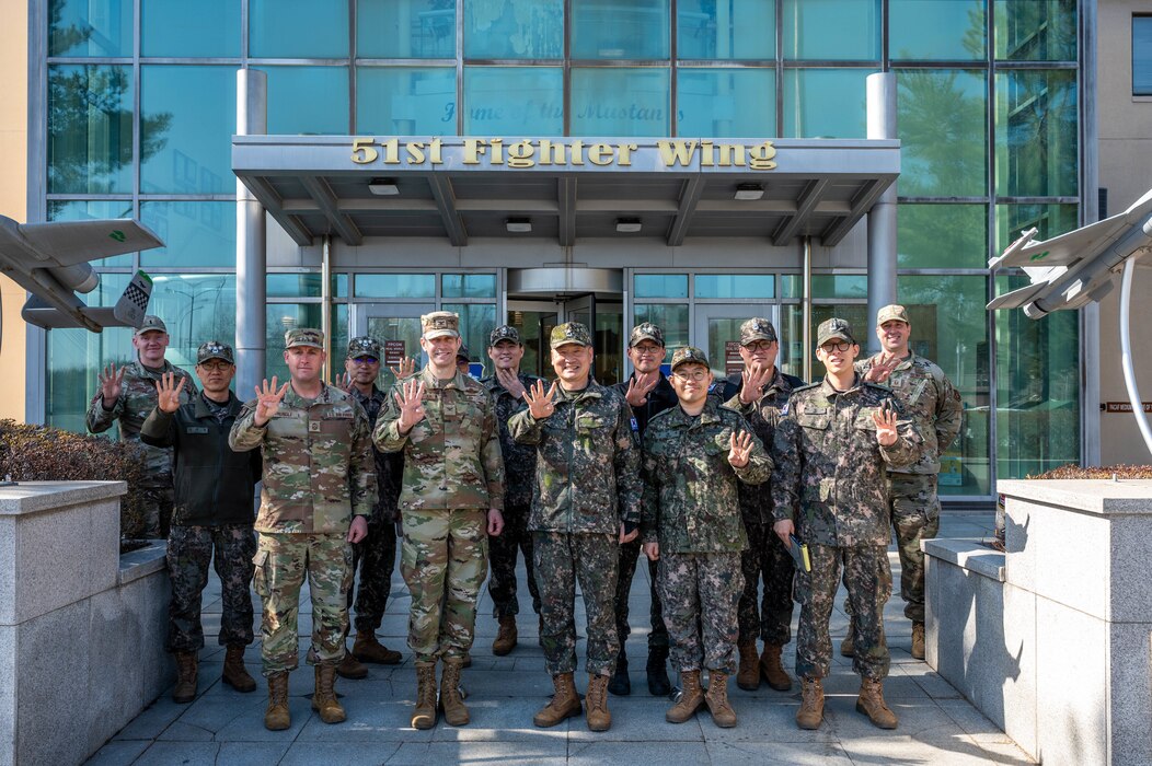 Members from the 51st Fighter Wing and Republic of Korea Army Combined Forces Command C4 pose for a group photo at Osan Air Base, ROK, Feb. 26, 2025. All CFC components are operationally  integrated through continuous combined and joint planning, training and exercises. (U.S. Air Force photo by Staff Sgt. Christopher Tam)