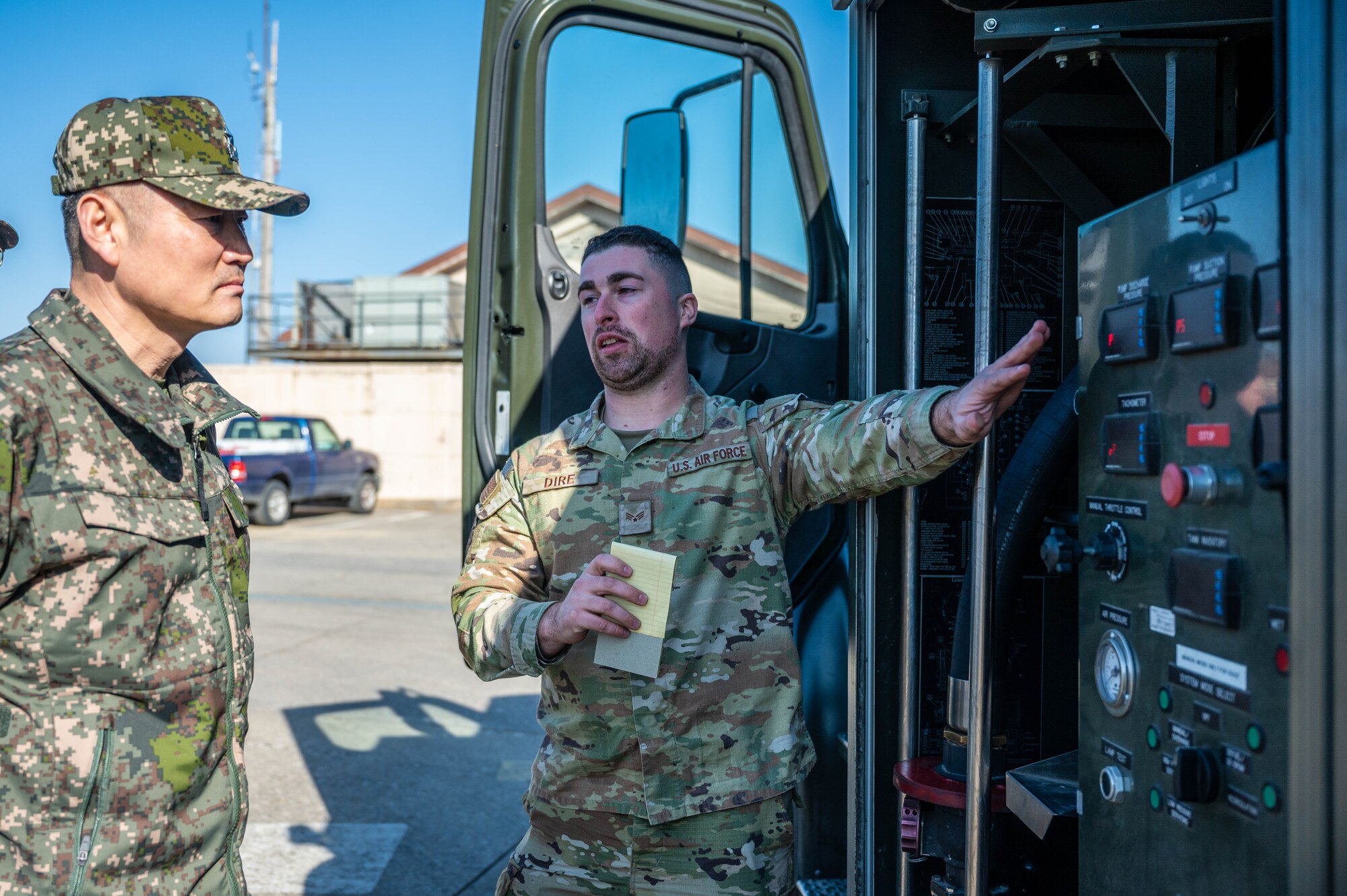 U.S. Air Force Senior Airman Nicholas Dire’, 51st Logistics Readiness Squadron fuels equipment maintenance technician, explains fuel truck operations to Republic of Korea Army Brig. Gen. Jung Hwan Lee, Combined Forces Command C4 director at Osan Air Base, ROK, Feb. 26, 2025. The CFC’s mission is to strengthen partnerships by enhancing contingency coordination and gaining insight into Osan’s capabilities. (U.S. Air Force photo by Staff Sgt. Christopher Tam)