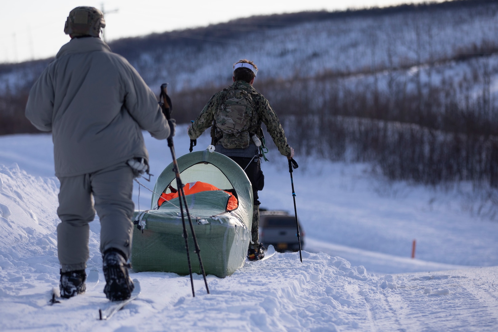 Exercise Special Operations Forces Arctic Medic 2025 participants transport a simulated combat casualty using a CASEVAC Ecosystem sled prototype at Yukon Training Area, Alaska, Feb. 18, 2025. SOFAM 2025 prepares medics to operate in extreme cold.