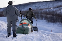 Exercise Special Operations Forces Arctic Medic 2025 participants transport a simulated combat casualty using a CASEVAC Ecosystem sled prototype at Yukon Training Area, Alaska, Feb. 18, 2025. SOFAM 2025 prepares medics to operate in extreme cold.