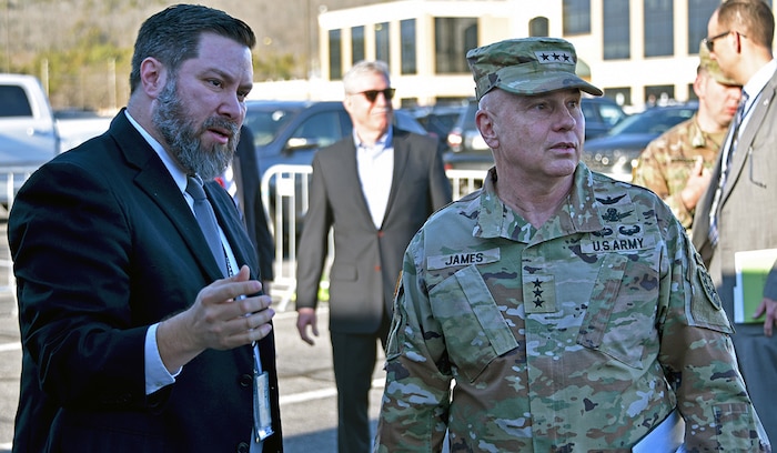 Russell Vela, chief, Multi-Domain Technologies Division, Research Directorate, Technical Center, briefs Lt. Gen. Thomas L. James, deputy commander of U.S. Space Command, on the U.S. Army Space and Missile Defense Command’s Spatially Enhanced Communications, Tracking, Reconnaissance, and Engagements, or SPECTRE, transportable distributed aperture research system. James visited the USASMDC’s Technical Center on Feb. 24 to meet team members and learn how their missions support USSPACECOM. (U.S. Army photo by Jason B. Cutshaw)