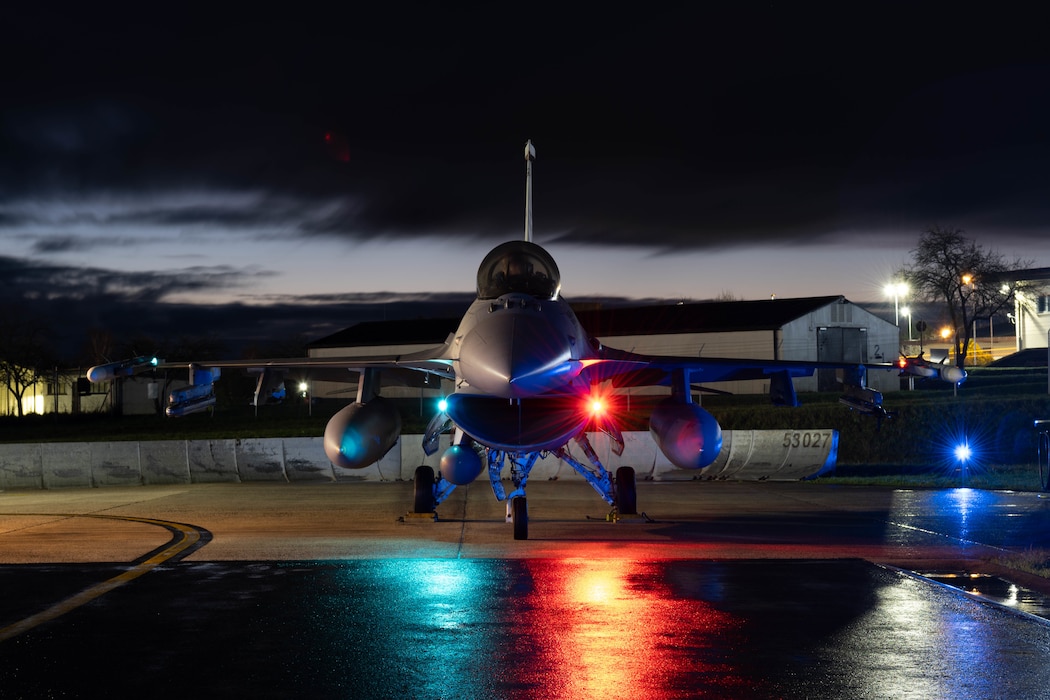 A F-16 Fighting Falcon sits on the flight line.