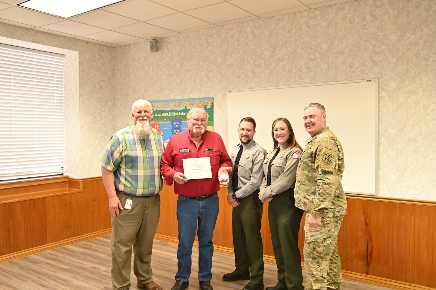 Stanly “Easy” Frerich, in red, is recognized as the 2024 U.S. Army Corps of Engineers’ Volunteer of the Year. Easy, who volunteers at Lake Georgetown, is the first volunteer from Fort Worth District in more than 10 years to be named the USACE volunteer of the year. In 2024 USACE had more than 37,900 volunteers across the command supporting natural resource management. In total, the volunteers served 1,751,141 hours, equivalent to 842 full-time employes. The total estimated value of volunteer hours is $58.6 million. Pictured from left to right are Scott Blank, lake manager at Lake Georgetown, Easy, Josh Houghtaling, a park ranger at Lake Georgetown, Madeline Karickhoff, a park ranger at Lake Georgetown, Col. Calvin Kroeger, Commander of the Fort Worth District.