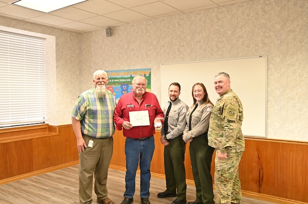 Stanly “Easy” Frerich, in red, is recognized as the 2024 U.S. Army Corps of Engineers’ Volunteer of the Year. Easy, who volunteers at Lake Georgetown, is the first volunteer from Fort Worth District in more than 10 years to be named the USACE volunteer of the year. In 2024 USACE had more than 37,900 volunteers across the command supporting natural resource management. In total, the volunteers served 1,751,141 hours, equivalent to 842 full-time employes. The total estimated value of volunteer hours is $58.6 million. Pictured from left to right are Scott Blank, lake manager at Lake Georgetown, Easy, Josh Houghtaling, a park ranger at Lake Georgetown, Madeline Karickhoff, a park ranger at Lake Georgetown, Col. Calvin Kroeger, Commander of the Fort Worth District.