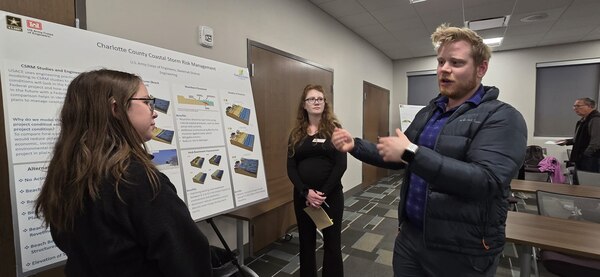 U.S. Army Corps of Engineers (USACE) Jacksonville District Economist Evan Jonson explains variables under consideration during the Charlotte County Coastal Storm Risk Management (CSRM) Study to a reporter from The Daily Sun, a Charlotte County publication.
