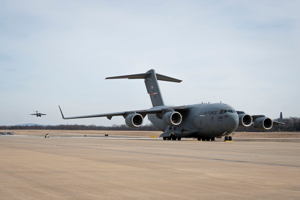 A C-17 Globemaster III prepares to land on the runway