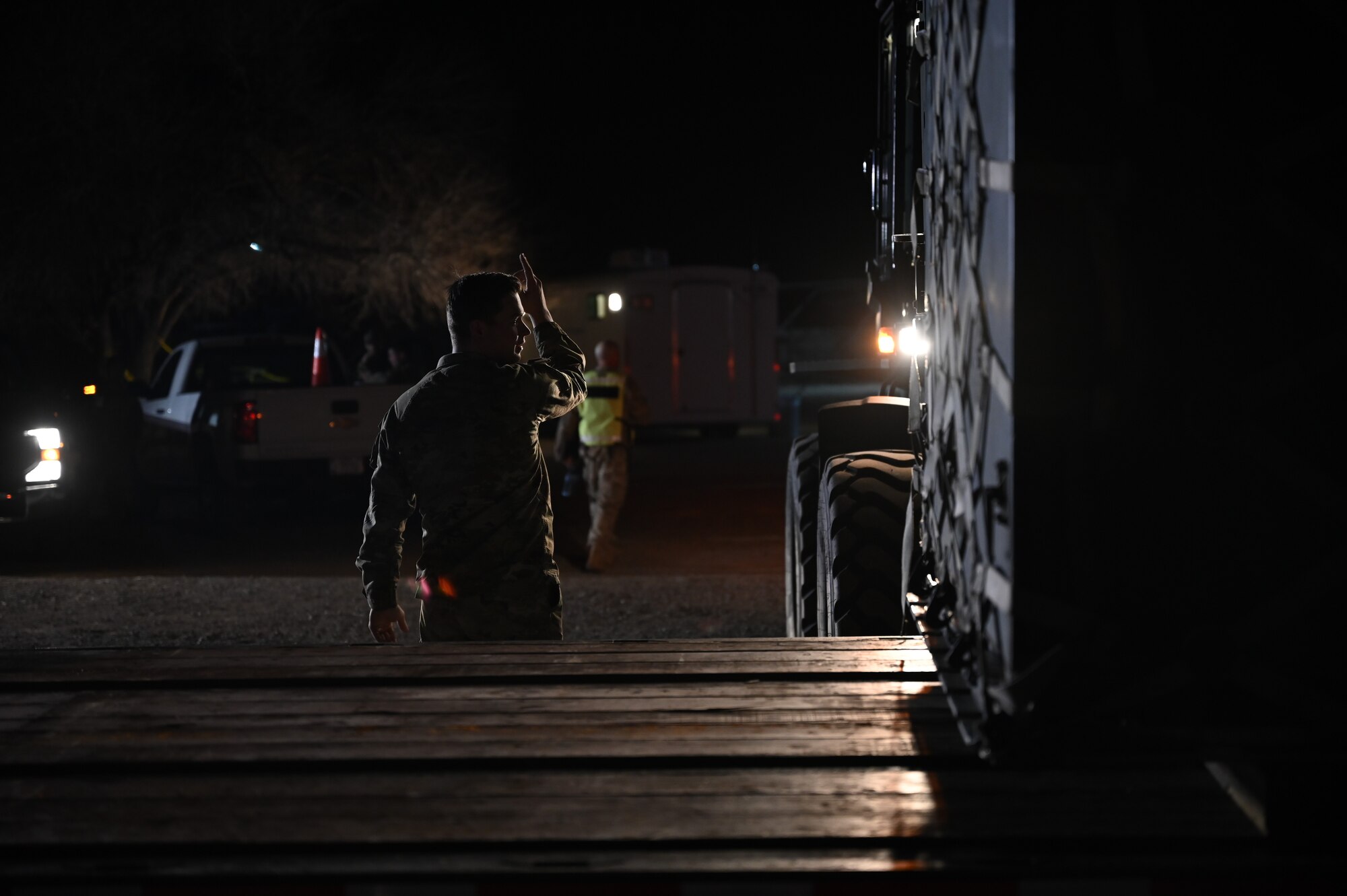 Senior Airman Bailey Weidner, 377th Logistic Readiness Squadron ground transportation, supervises the unloading of essential equipment during an incident response exercise on Feb. 25 in Santa Fe, N.M. As part of the exercise, Weidner ensures the smooth and efficient operation of logistics operations, contributing to the Department of Defense's preparedness. The exercise brings together local, state, and federal agencies to improve coordination and enhance joint response capabilities. Weidner’s expertise in managing ground transportation plays a vital role in maintaining the flow of necessary resources, emphasizing the importance of operational readiness and teamwork in handling emergency response. (U.S. Air Force photo by Airman 1st Class Donnell Schroeter)