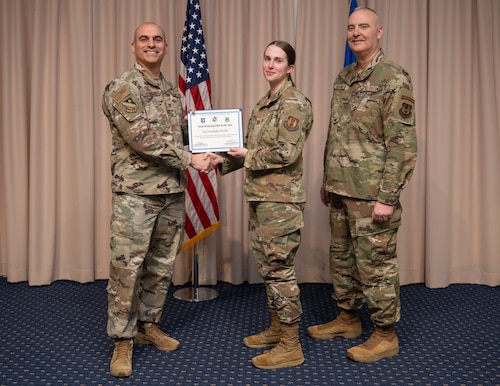 Image of a person receiving a certificate.