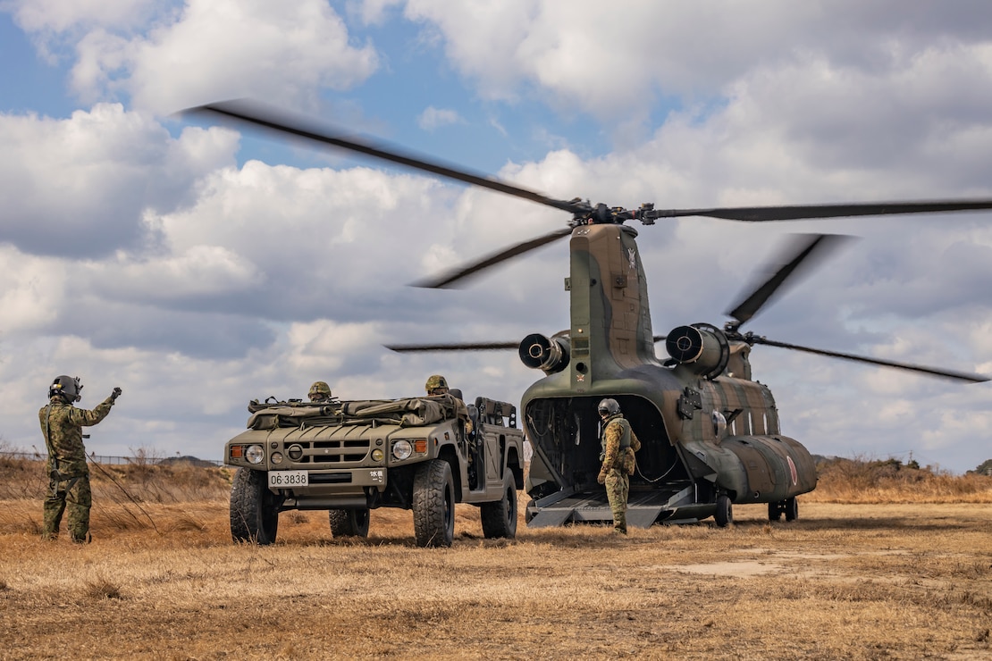 Japan Ground Self-Defense Force members with 1st Amphibious Rapid Deployment Regiment, embark a high mobility multipurpose wheeled vehicle onto a CH-47 Chinook helicopters assigned to 1st Helicopter Brigade, during a bilateral insert exercise in support of Iron Fist 25, at JGSDF Camp Ainoura, Sasebo, Nagasaki, Japan, Feb. 23, 2025.