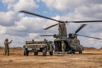 Japan Ground Self-Defense Force members with 1st Amphibious Rapid Deployment Regiment, embark a high mobility multipurpose wheeled vehicle onto a CH-47 Chinook helicopters assigned to 1st Helicopter Brigade, during a bilateral insert exercise in support of Iron Fist 25, at JGSDF Camp Ainoura, Sasebo, Nagasaki, Japan, Feb. 23, 2025.