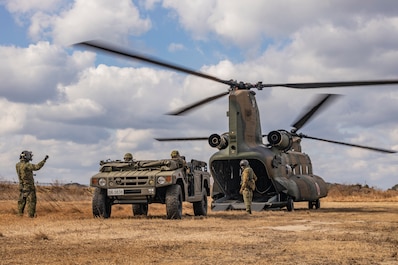 NAGASAKI, Japan (Feb. 23, 2025) — Japan Ground Self-Defense Force members with 1st Amphibious Rapid Deployment Regiment, embark a high mobility multipurpose wheeled vehicle onto a CH-47 Chinook helicopters assigned to 1st Helicopter Brigade, during a bilateral insert exercise in support of Iron Fist 25, at JGSDF Camp Ainoura, Sasebo, Nagasaki, Japan, Feb. 23, 2025. Iron Fist is an annual bilateral exercise designed to increase interoperability and strengthen the relationships between the U.S. Marine Corps, U.S. Navy and Japan Ground Self-Defense Force. The 31st MEU, the Marine Corps’ only continuously forward deployed MEU, provides a flexible and lethal force, ready to perform a wide range of military operations as the premiere crisis response force in the Indo-Pacific region. (U.S. Marine Corps photo by Sgt. Tyler Andrews)