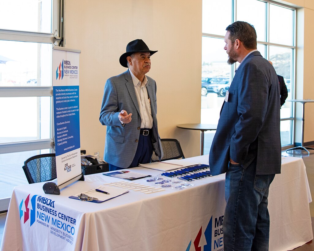 An attendee of the USACE-Albuquerque District’s Business Opportunities Open House speaks with a representative from the U.S. Chamber of Commerce Minority Business Development Agency, one of several other agencies that also participated in the event at the Sid Cutter Pilot’s Pavilion at the Balloon Fiesta Park in Albuquerque, N.M., Feb. 20, 2025.