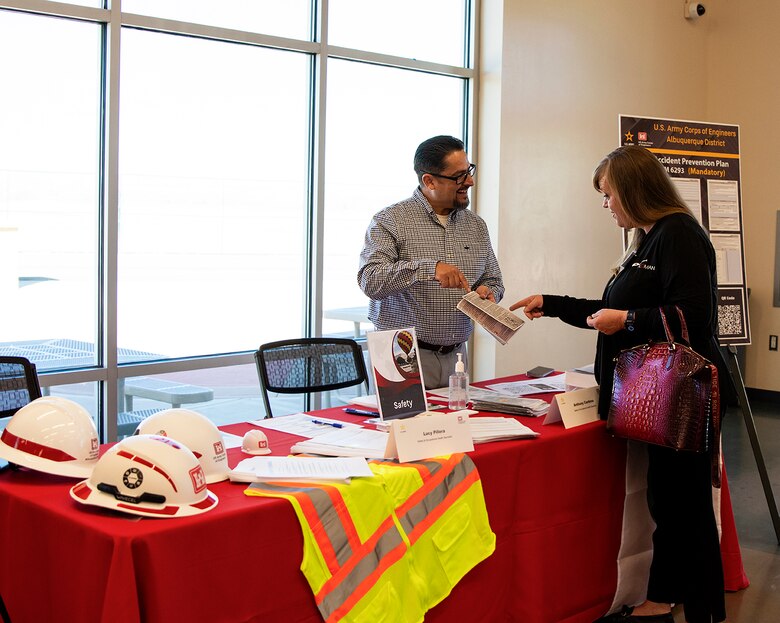 Anthony Cardona (left), safety and occupational health specialist, USACE-Albuquerque District, speaks with an attendee during the district’s annual Business Opportunities Open House at the Sid Cutter Pilot’s Pavilion at the Balloon Fiesta Park in Albuquerque, N.M., Feb. 20, 2025.