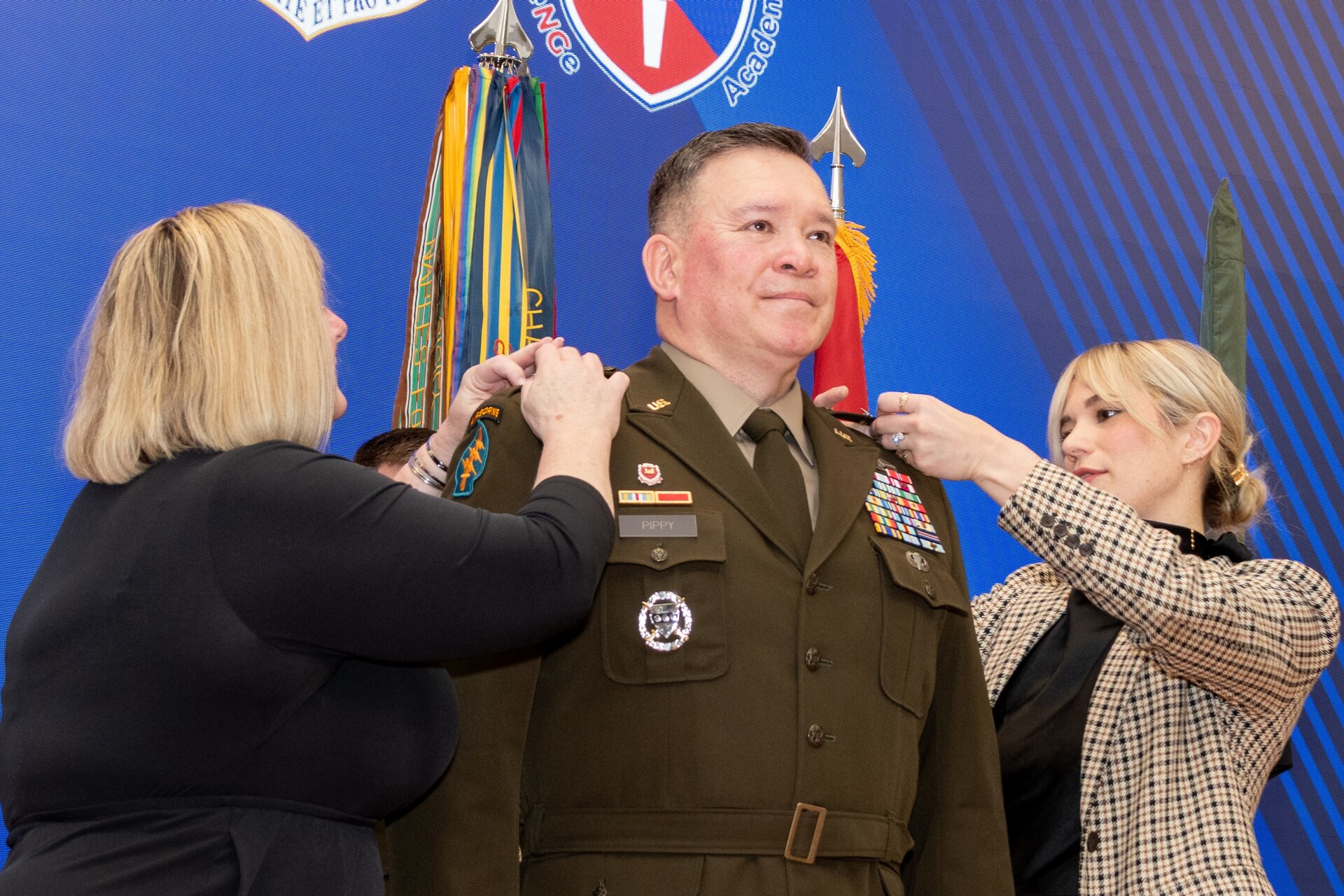 Maj. Gen. John Pippy's family members pin on his new rank during a ceremony Feb. 28, 2025, at Fort Indiantown Gap, Pa. During the ceremony, Pippy was promoted to his current rank, and Pennsylvania Gov. Josh Shapiro swore in Pippy as Pennsylvania’s 55th adjutant general. (Pennsylvania National Guard photo by Wayne V. Hall)