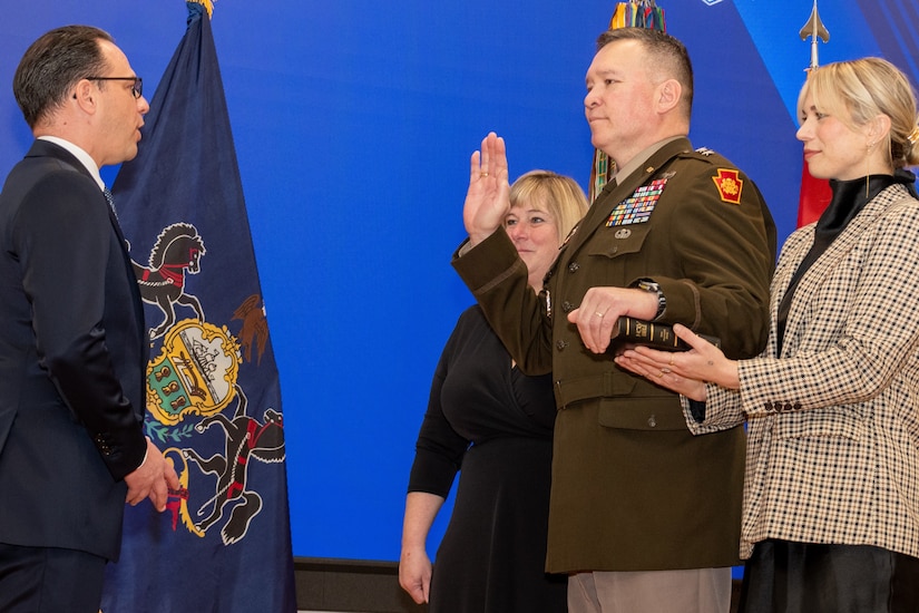 Pennsylvania Gov. Josh Shapiro, left, swears in Maj. Gen. John Pippy as Pennsylvania’s 55th adjutant general during a ceremony Feb. 28, 2025, at Fort Indiantown Gap, Pa. During the ceremony, Pippy was also promoted to his current rank. (Pennsylvania National Guard photo by Wayne V. Hall)