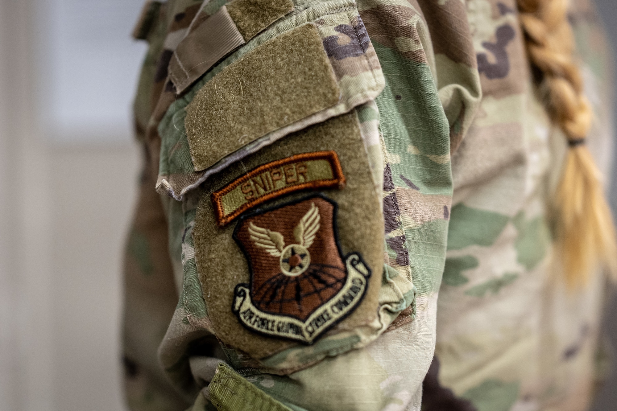U.S. Air Force Senior Airman Samantha Karnes, 509th Security Forces Squadron defender, turns in a M110A1 Squad Designated Marksman Rifle on Whiteman Air Force Base, Missouri, February 21, 2025. Airmen who’ve passed the sniper engagement course can wear the sniper tab. (U.S. Air Force photo by Tech. Sgt. Nicholas Alder)