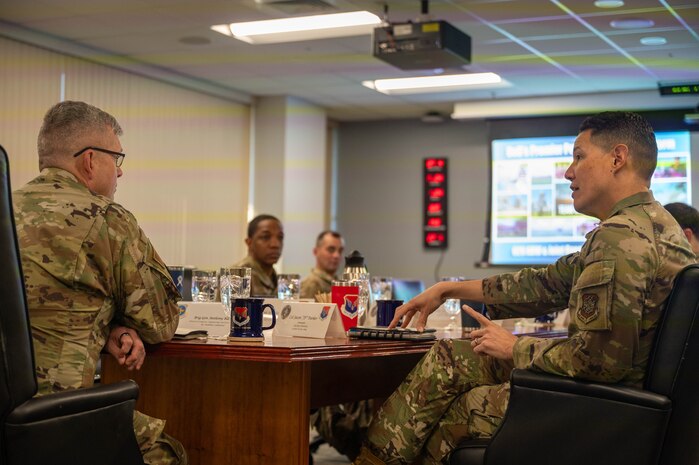 U.S. Air Force Brig. Gen. Anthony Babcock, Air Mobility Command director of logistics, engineering and force protection, receives a mission brief from Col. Jason Parker, 628th Air Base Wing and Joint Base Charleston commander, at Joint Base Charleston, South Carolina, Feb. 27, 2025.
