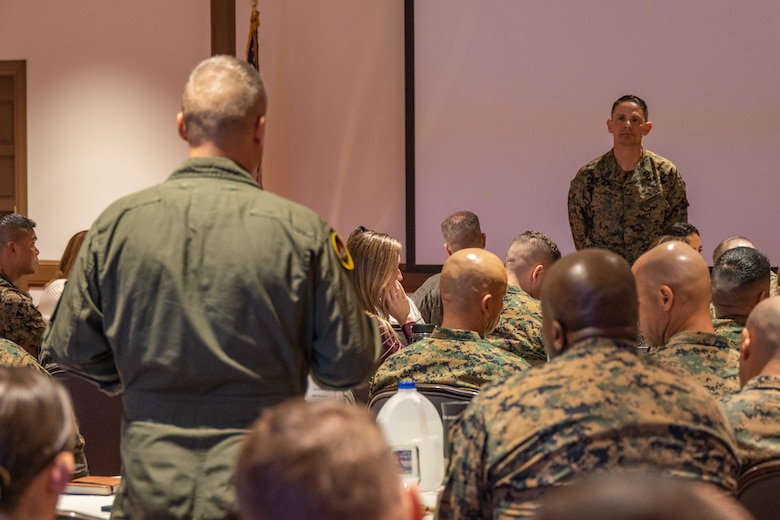 U.S. Marine Corps Sgt. Maj. Carlos A. Ruiz, the Sergeant Major of the Marine Corps, takes a question from Lt. Col. Justin K. Sing, the commanding officer of Marine Medium Tiltrotor Squadron (VMM) 362, Marine Aircraft Group 16, 3rd Marine Aircraft Wing, during the 3rd MAW Commander’s Course at Marine Corps Air Station Miramar, California, Feb. 26, 2025. The Commander's Course brought together leadership from across 3rd MAW to explore key topics ranging from science and technology, safety and unit culture, fostering readiness for future challenges, and enhancing understanding of the MAW's critical role in supporting I Marine Expeditionary Force objectives and the joint force. (U.S. Marine Corps photo by Lance Cpl. Jennifer Sanchez)