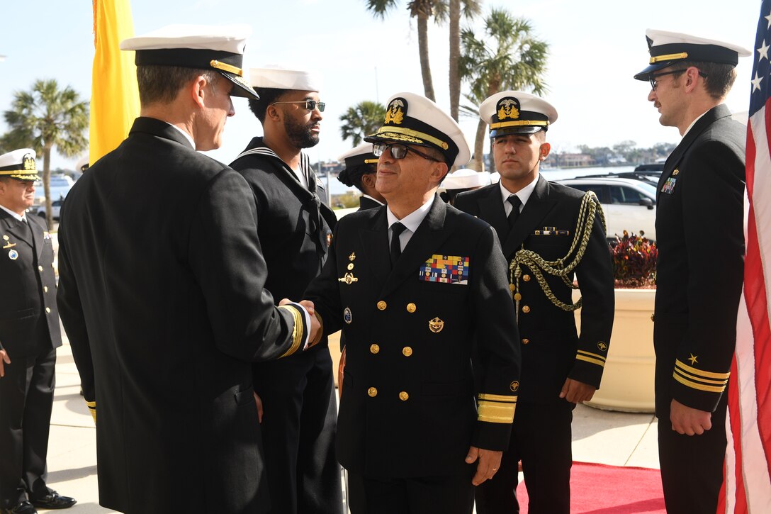 Rear Adm. Carlos Sardiello, Commander, U.S. Naval Forces Southern Command/U.S. 4th Fleet, left, greets Ecuadorian Rear Adm. Luis Eduardo Piedra, General Inspector of the Ecuadorian Navy, center, following welcoming honors during the beginning of the U.S.-Ecuador Maritime Staff Talks at the historic St. Francis Barracks, now headquarters building of the Florida National Guard, in St. Augustine, Fla., February 27, 2025. Maritime Staff Talks (MST) serve as an annual comprehensive engagement venue to program, direct, and coordinate all maritime activities between the U.S. and Partner Nations. The overarching MST objective is to increase coordination and integration across the U.S. maritime services and Partner Nations to plan and conduct theater-level security cooperation in order to provide combatant commanders more effective and efficient maritime force packages. U.S. Naval Forces Southern Command/U.S. 4th Fleet is the trusted maritime partner for Caribbean, Central and South America maritime forces leading to improved unity, security and stability. (U.S. Navy photo by Mass Communication Specialist First Class Steven Khor/Released)