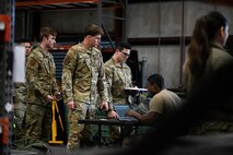 Airmen receive individual protective gear on the first day of BATTLE school.