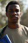 An airman stands with a serious face during BATTLE school.
