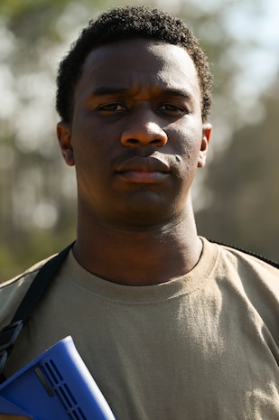 An airman stands with a serious face during BATTLE school.