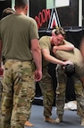 Airmen demonstrate combative techniques during BATTLE school.