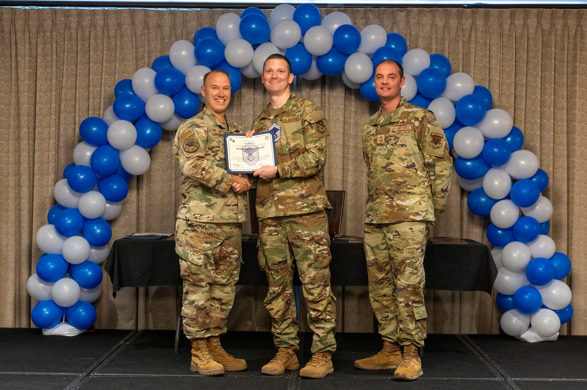 airmen gets promoted on stage