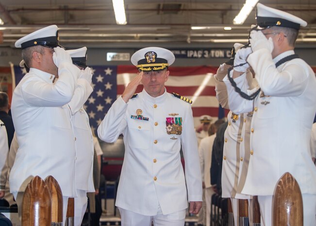 Capt. Jason Geddes, commander, Unmanned Undersea Vehicle Squadron (UUVRON) 1, is piped through sideboys after a change of command ceremony at Naval Base Kitsap-Keyport, Washington Sept. 25, 2023. During the ceremony, Capt. Jason Geddes, from Indianapolis, relieved Capt. Jason Weed as commander, Unmanned Undersea Vehicle Squadron (UUVRON) 1. (U.S. Navy photo by Mass Communication Specialist 2nd Class Victoria Galbraith)