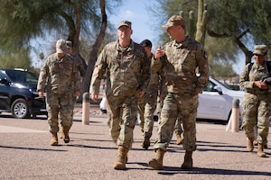 Chief of Space Operations Gen. Chance Saltzman, left, walks with Maj. Gen. David Mineau, right, Air Forces Southern commander, during a visit to AFSOUTH headquarters at Davis-Monthan Air Force Base, Arizona, Feb. 27, 2025. The trip marked Saltzman’s first visit to AFSOUTH where he received a mission brief from local Guardians on their contributions to advancing space capabilities in the U.S. Southern Command area of responsibility. (U.S. Air Force photo by Tech. Sgt. Rachel Maxwell)