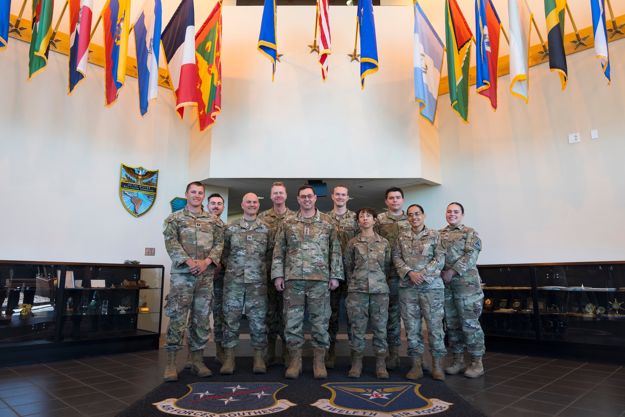 Chief of Space Operations Gen. Chance Saltzman, center, takes a group photo with Guardians and Airmen assigned to Air Forces Southern space forces at Davis-Monthan Air Force Base, Arizona, Feb. 27, 2025. The trip marked Saltzman’s first visit to AFSOUTH where he received a mission brief from local Guardians on their contributions to advancing space capabilities in the U.S. Southern Command area of responsibility. (U.S. Air Force photo by Tech. Sgt. Rachel Maxwell)