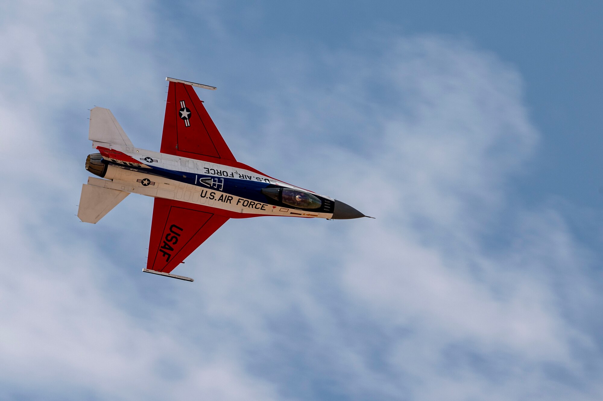 U.S. Air Force Maj. Taylor “FEMA” Heister, F-16 Viper Demonstration Team pilot and commander, flies during the Heritage Flight Training Course at Davis-Monthan Air Force Base, Arizona, Feb. 28, 2025. In 2024, the team released a 50th anniversary paint scheme, paying homage to the YF-16 prototype that first flew at Edwards AFB in 1974. (U.S. Air Force photo by Airman Samantha Melecio)