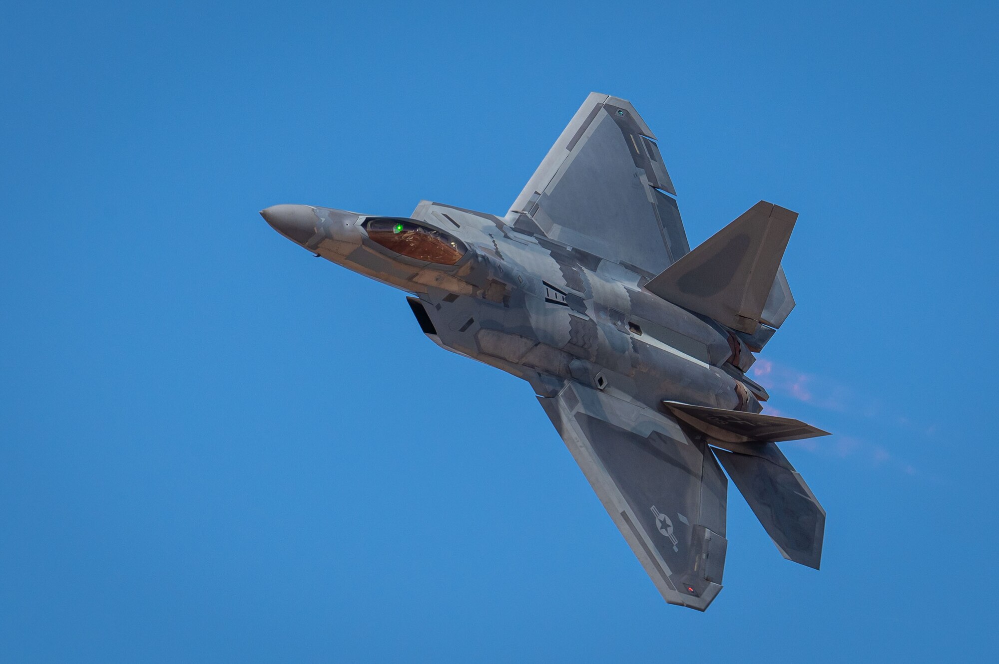 A U.S. Air Force F-22 Raptor aircraft flies during the Heritage Flight Training Course at Davis-Monthan Air Force Base, Arizona, Feb. 28, 2025. The F-22 Raptor Demonstration Team travels around the country, as well as internationally, to recruit, retain and inspire the next generation of Airmen. (U.S. Air Force photo by Senior Airman Jasmyne Bridgers-Matos)