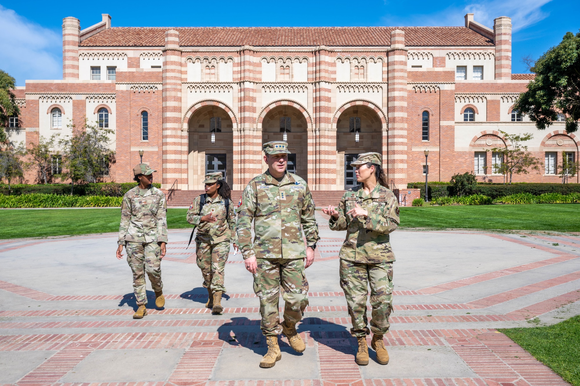 A general walks with ROTC leadership