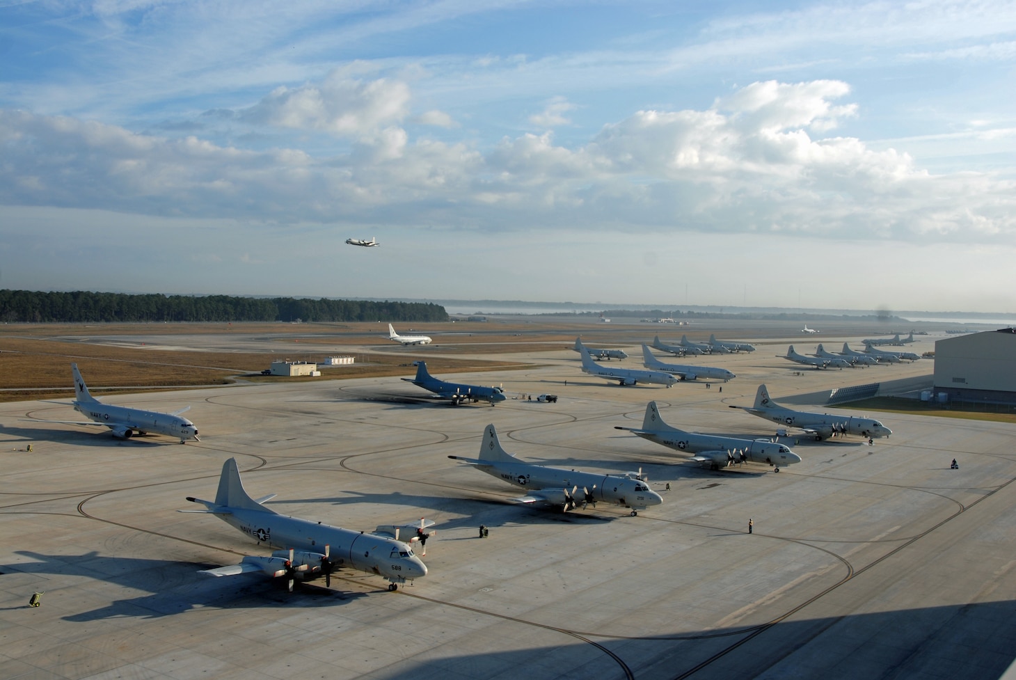 3C Orion and P-8A Poseidon aircraft occupy the flight line at Naval Air Station Jacksonville.